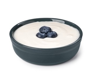 Bowl of delicious yogurt with blueberries isolated on white