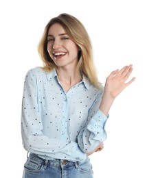 Photo of Cheerful young woman waving to say hello on white background
