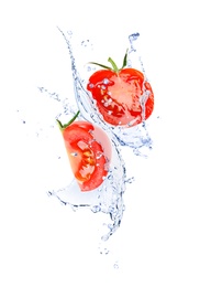 Fresh cut tomatoes with water splash on white background