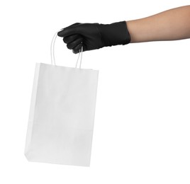 Woman holding shopping paper bag on white background