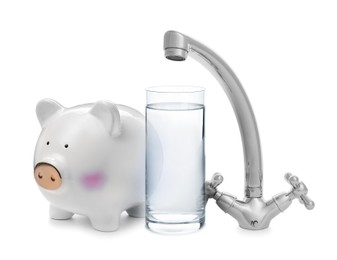 Water scarcity concept. Piggy bank, tap and glass on white background