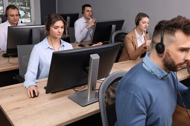 Call center operator working in modern office
