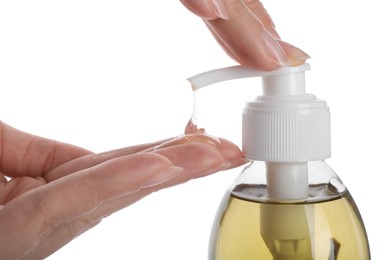 Woman using liquid soap dispenser on white background, closeup