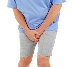 Mature man with urological problems suffering from pain on white background