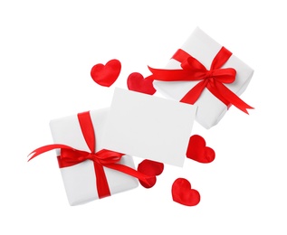 Blank card, gift boxes and red decorative hearts on white background, top view. Valentine's Day celebration