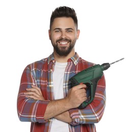 Young man with power drill on white background