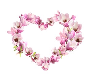 Beautiful heart shaped composition made with tender magnolia flowers on white background