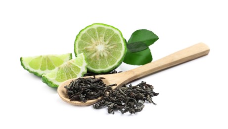 Photo of Dry bergamot tea leaves, wooden spoon and fresh fruit on white background