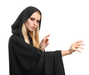 Photo of Witch in black mantle isolated on white. Scary fantasy character