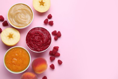 Different puree in bowls and fresh ingredients on pink background, flat lay. Space for text