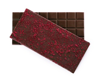 Photo of Chocolate bars with freeze dried berries on white background, top view