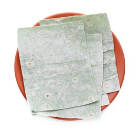 Photo of Plate with delicious green Armenian lavash on white background, top view