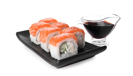 Tasty sushi rolls and soy sauce on white background