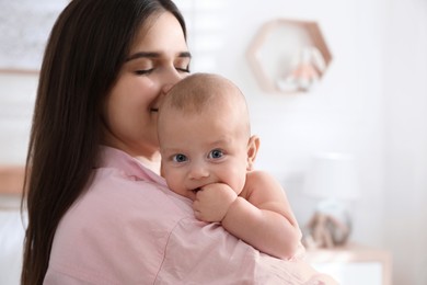 Mother with her cute baby at home