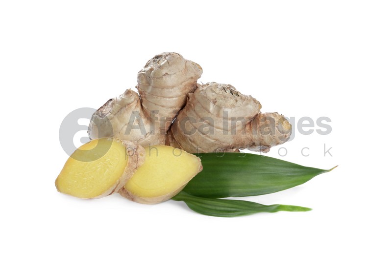 Photo of Whole and cut fresh ginger with leaves isolated on white