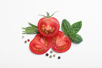 Photo of Fresh green basil leaves, spices with cut tomato on white background, top view