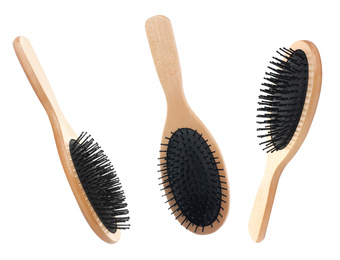 Set with wooden hair brushes on white background
