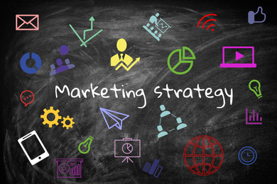 Image of Black chalkboard with marketing strategy and icons