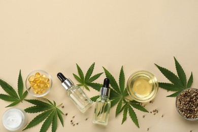 Flat lay composition with hemp leaves, CBD oil and THC tincture on beige background, space for text