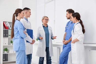 Photo of Team of doctors having discussion in clinic