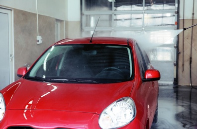 Clean automobile at professional car wash service