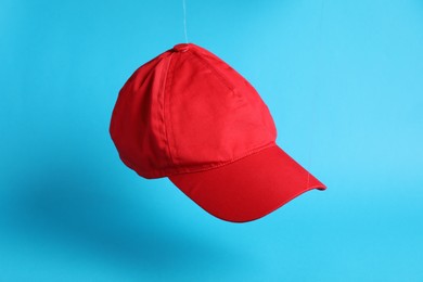 Baseball cap on light blue background. Mock up for design