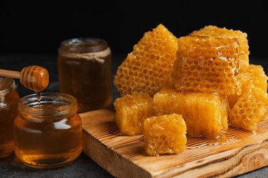 Composition with fresh honey on grey table