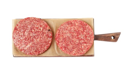 Raw hamburger patties and wooden board on white background, top view