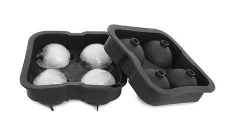 Frozen ice balls in mold on white background