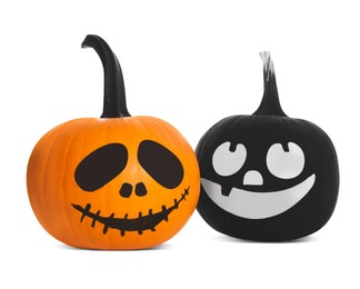 Halloween pumpkins with scary drawn faces on white background