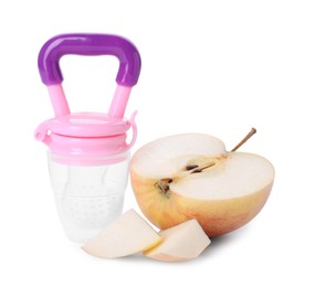 Empty nibbler and cut apple on white background. Baby feeder