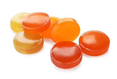 Many different color cough drops on white background