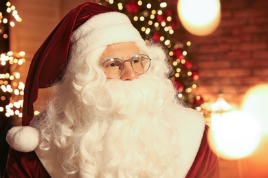 Portrait of Santa Claus against festive lights