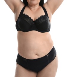 Overweight woman in black underwear on white background, closeup. Plus-size model
