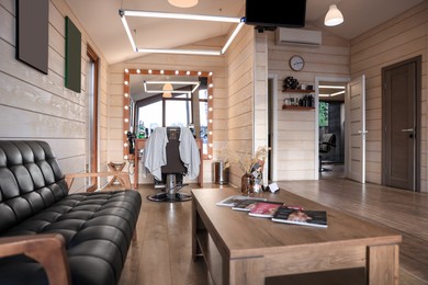 Stylish barbershop interior with hairdresser's workplace and modern furniture