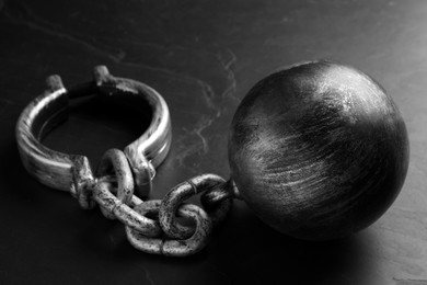 Prisoner ball with chain on black table