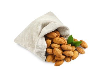 Sack with organic almond nuts and green leaves on white background. Healthy snack