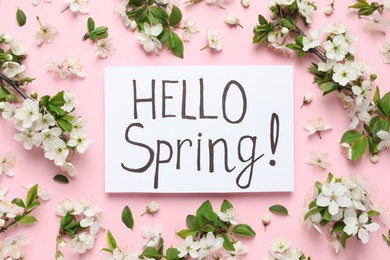 Beautiful flowers and Hello Spring card on pink background, flat lay