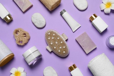Spa essentials on violet background, flat lay