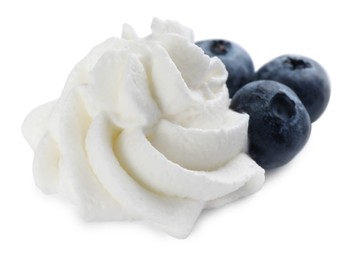 Delicious fresh whipped cream with blueberries isolated on white