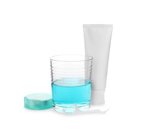 Mouthwash, dental floss and toothpaste on white background