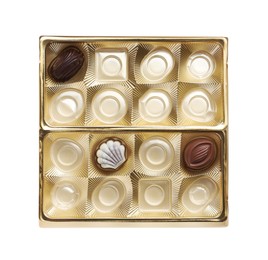 Photo of Partially empty box of chocolate candies isolated on white, top view