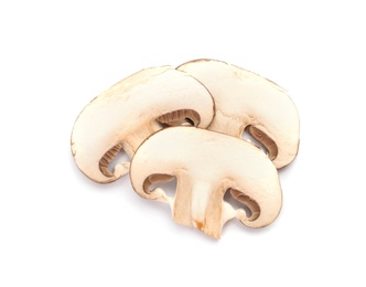 Slices of fresh champignon mushrooms on white background, top view