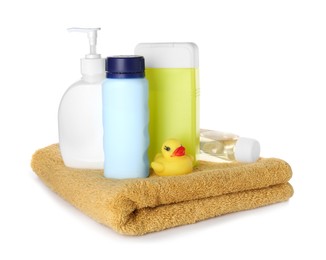 Bottles of baby cosmetic products, towel and rubber duck on white background