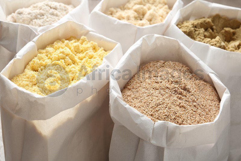 Different types of flour in paper bags