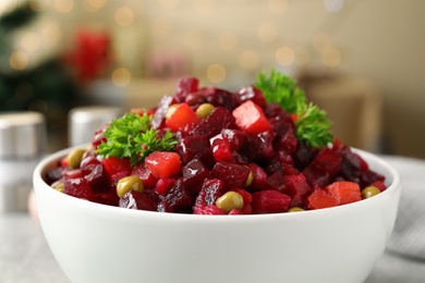 Traditional Russian salad vinaigrette in bowl, closeup