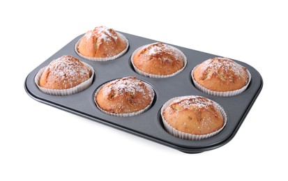 Tasty homemade muffins powdered with sugar in tray on white background