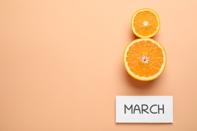 8 March greeting card design with cut citrus and space for text on orange background, flat lay. International Women's day