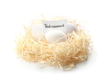 Eggs and card with word RETIREMENT in nest on white background. Pension concept