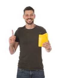 Man holding yellow container of motor oil and pointing up on white background